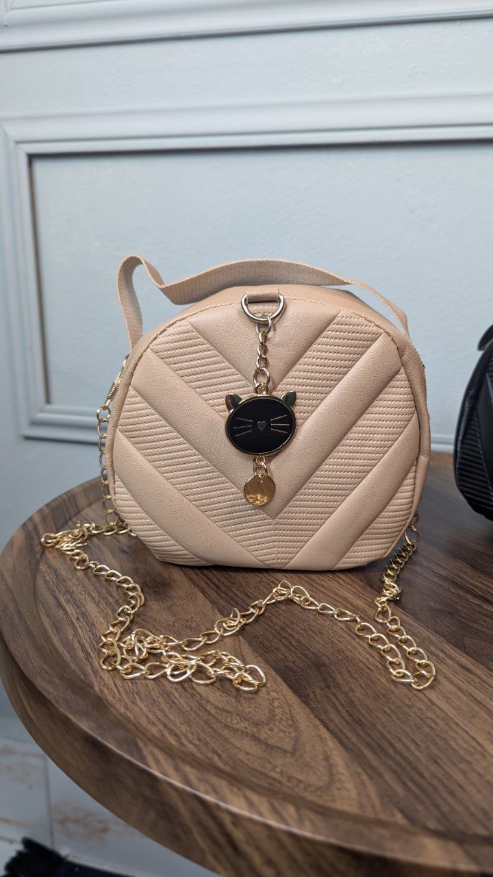 Attire Diagonal Round Bag