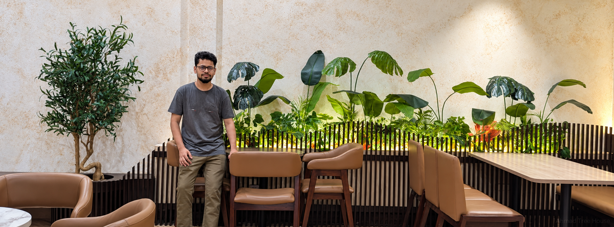 Tropical planting border behind restaurant dining seats — Ahmad Tree House project