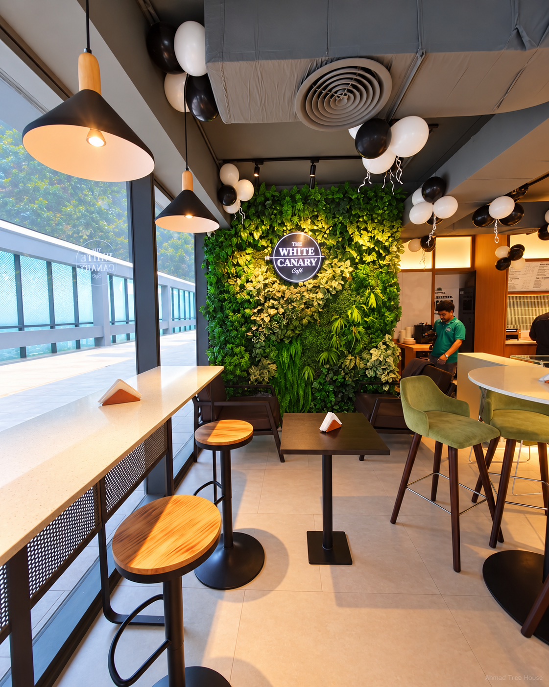 The White Canary Café window counter and green wall — Ahmad Tree House project