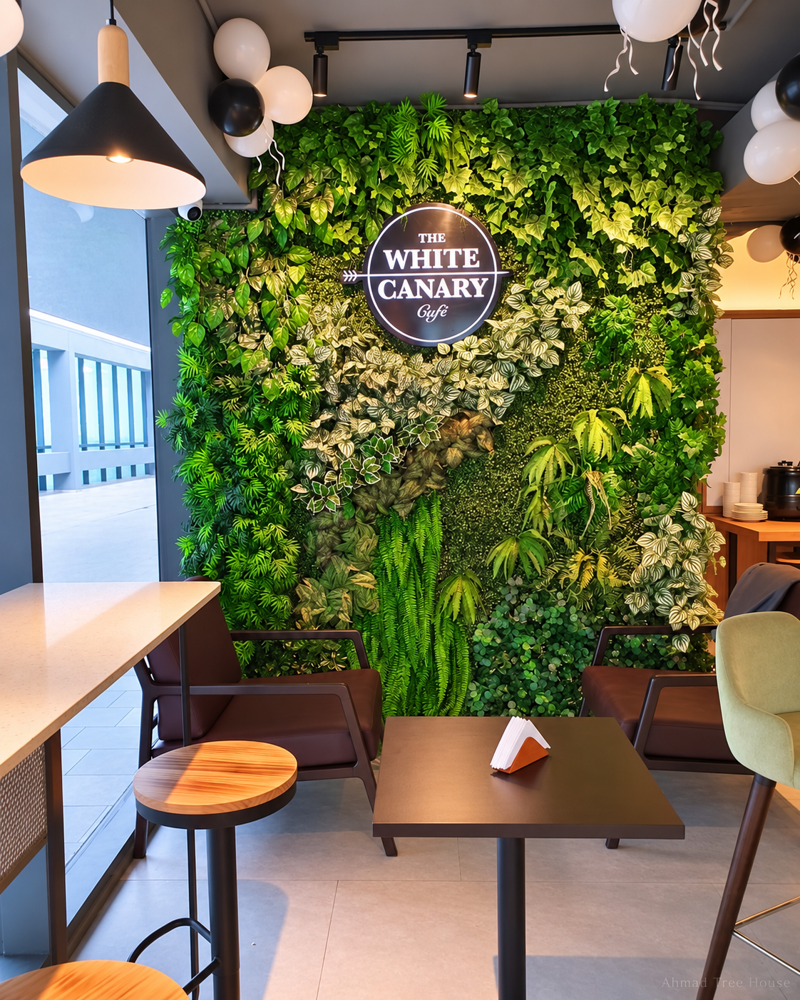 The White Canary Café green wall viewed from the front — Ahmad Tree House project