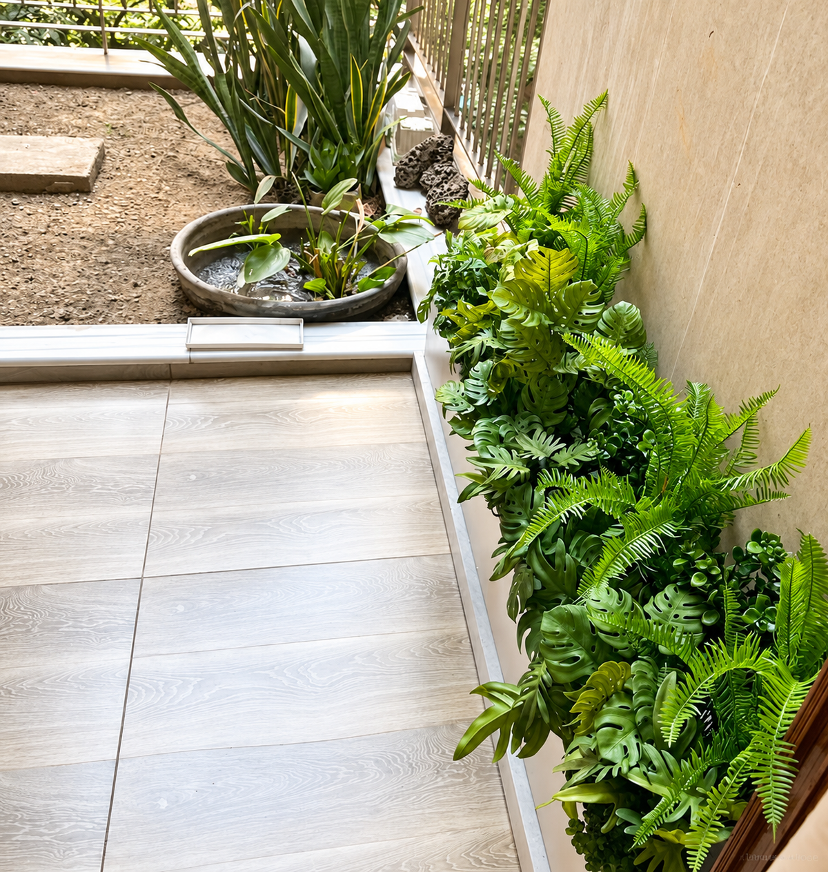 Mixed greenery border along an indoor window — Ahmad Tree House project