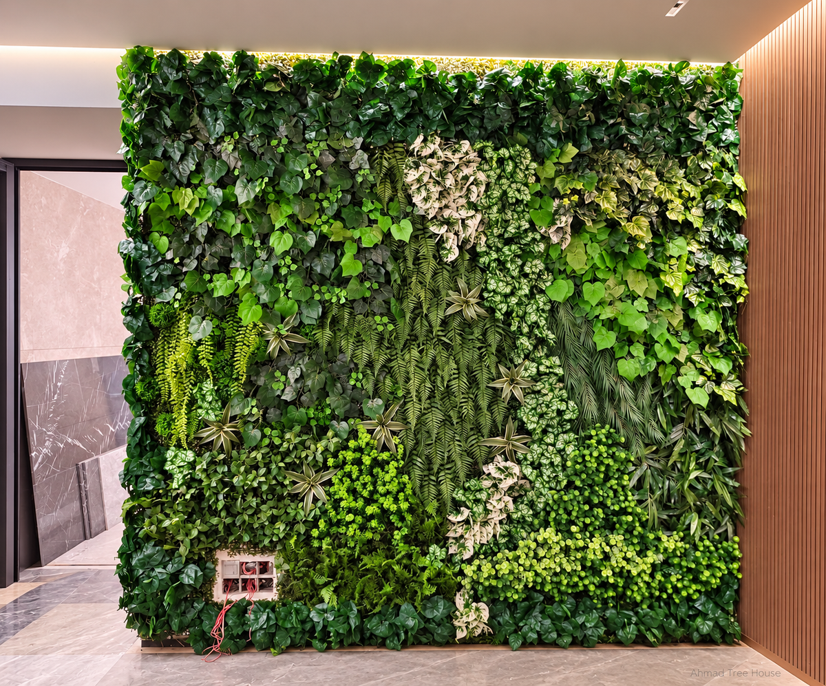 Mixed-leaf vertical garden viewed from the front — Ahmad Tree House project