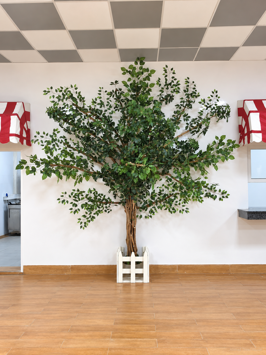 Branching restaurant tree beside colourful benches — Ahmad Tree House project