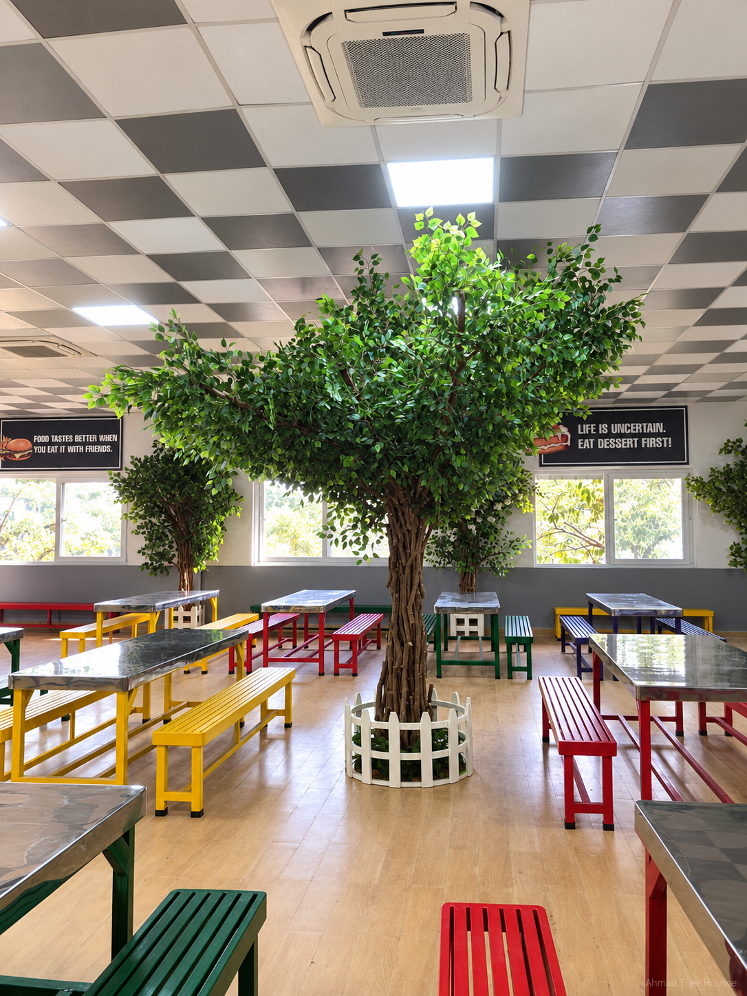 Restaurant dining overview with a central tree — Ahmad Tree House project