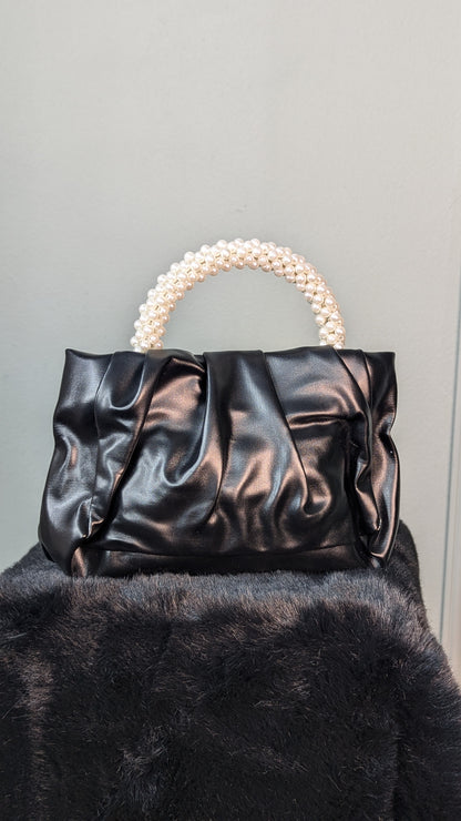 Attire Clutch with a pearl-beaded handle