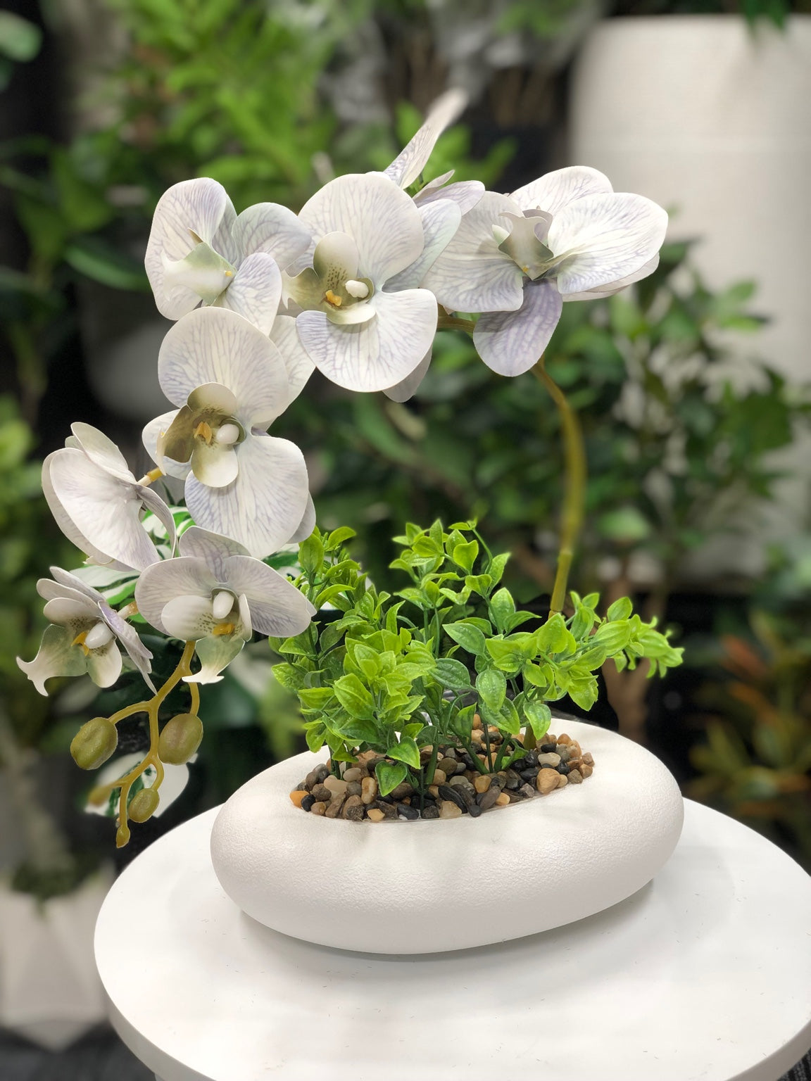 Artificial white orchid arrangement side view